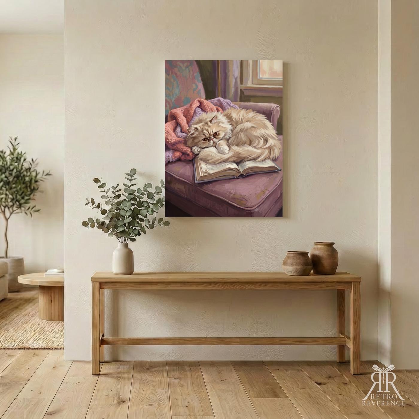 Custom cat portrait of a cat curled on a velvet reading chair beside an open book, framed and hanging on a wall at home